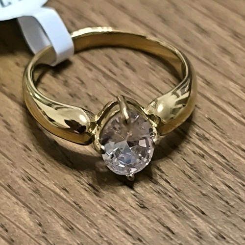 Gold ring with white crystal stone new, size 8