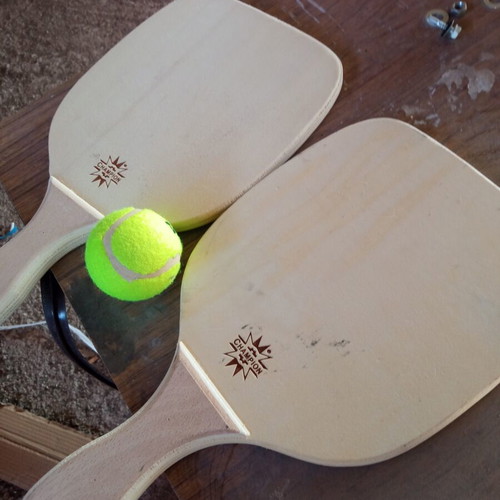 Wooden rackets with ball used, minor imperfections