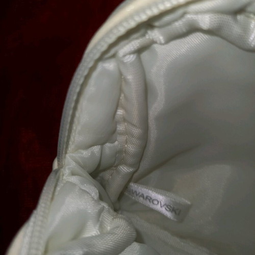 Swarovski and Clarins toiletry bags like new, set of 2 white