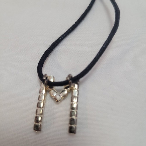 Women's necklace with 'M' monogram and rhinestones