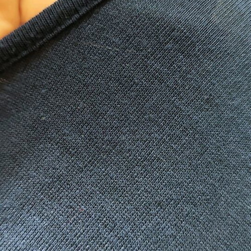 Navy draped blouse like new, size M/L with flower detail