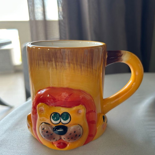 Children's ceramic mugs used, vintage with embossed elephant and lion