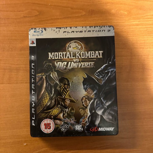 Mortal Kombat vs DC steelbook used, PS3