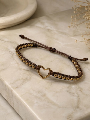 Handmade bracelet with gold beads and steel heart