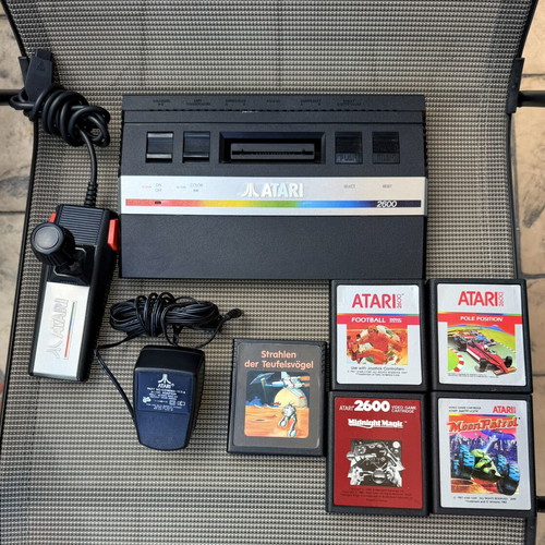 Atari 2600 console with 5 games and accessories