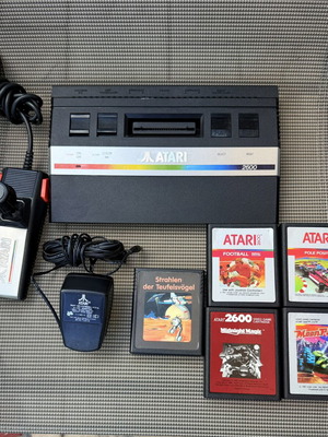 Atari 2600 console with 5 games and accessories