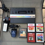 Atari 2600 console with 5 games and accessories