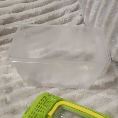 Plastic aquarium used with orange and blue gravel and accessories