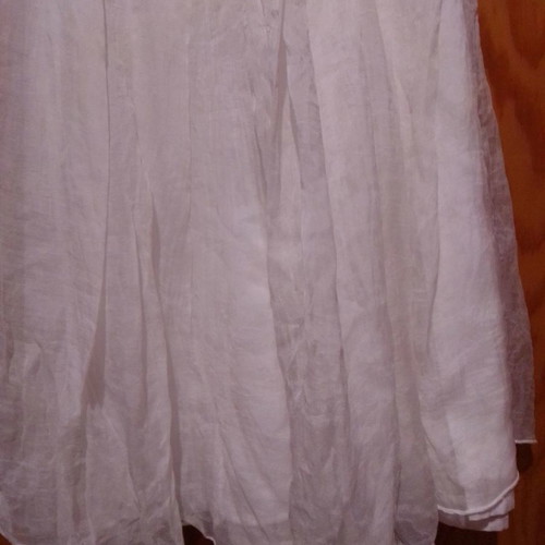 Two white dresses used, sizes 12-14 for girls