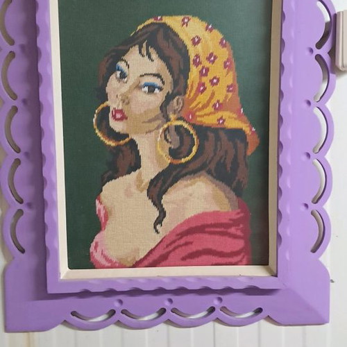 Embroidered frame used with wooden frame