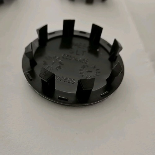 Kia 58mm wheel center caps new, black with red letters