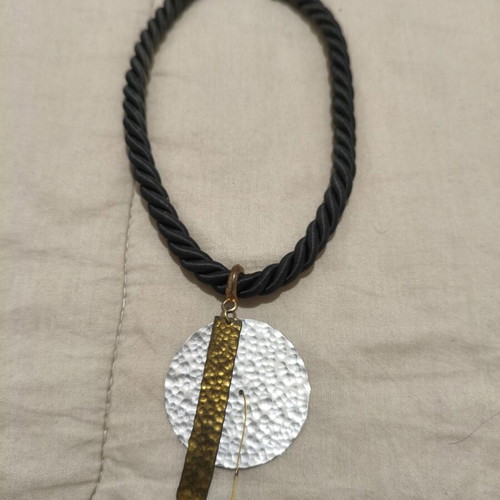 Statement handmade necklace with black rope and hammered metal elements like new
