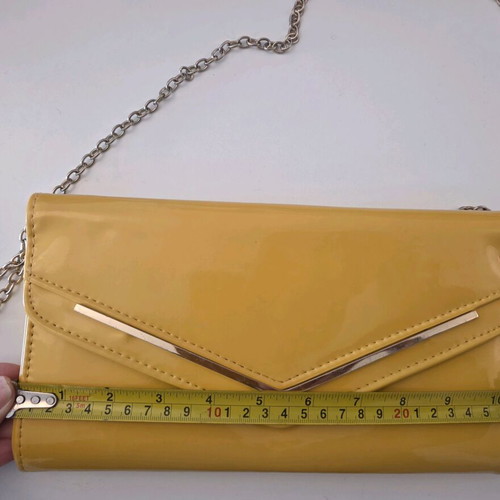 Aldo yellow vinyl clutch bag used with gold trim