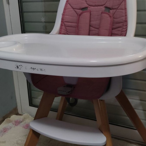 Kinderkraft high chair used with feeding accessories