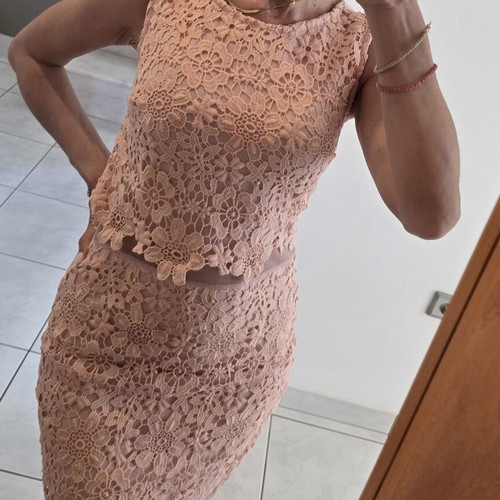 Lace dress in salmon peach shade with floral pattern and waist detail