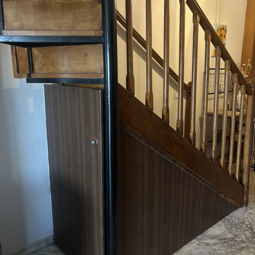 Wooden indoor staircase used with storage