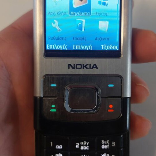 Nokia 6500 Slide phone like new with original charger, silver/black