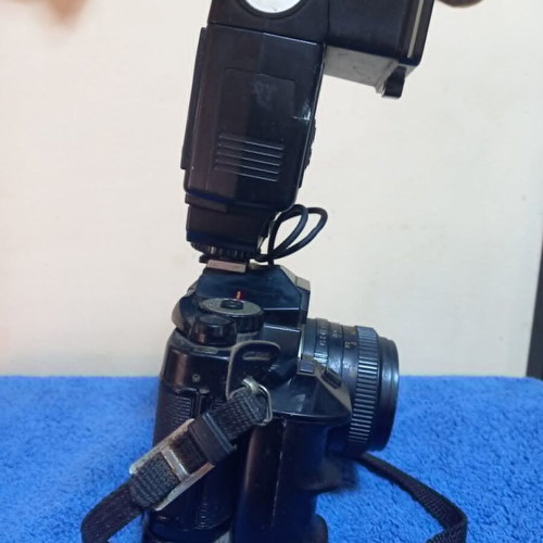 Revueflex AC2 35mm SLR film camera used with Sunpak Auto 26 DX flash