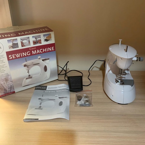 Sewing machine with battery like new with box and unused accessories