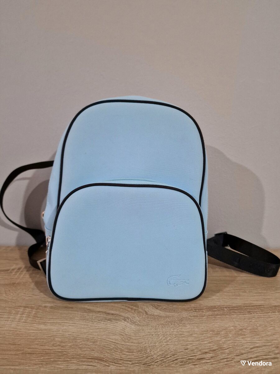 Lacoste mini backpack in a soft light blue shade with navy blue trim accents. Lacoste mini backpack in a soft light blue shade with navy  main image 4