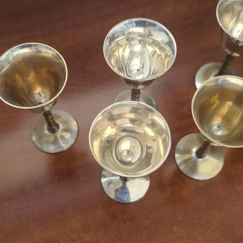 Silver-plated liqueur glasses used with some wear