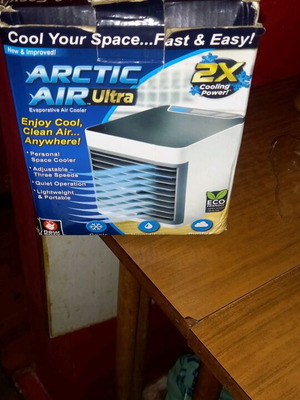 Mini Air Cool new, charges via USB, uses ice cubes