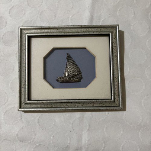 Vintage photo frame with silver sailboat