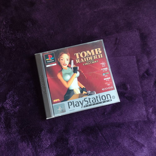 Tomb Raider II PS1 Platinum Edition game used, case with cracks