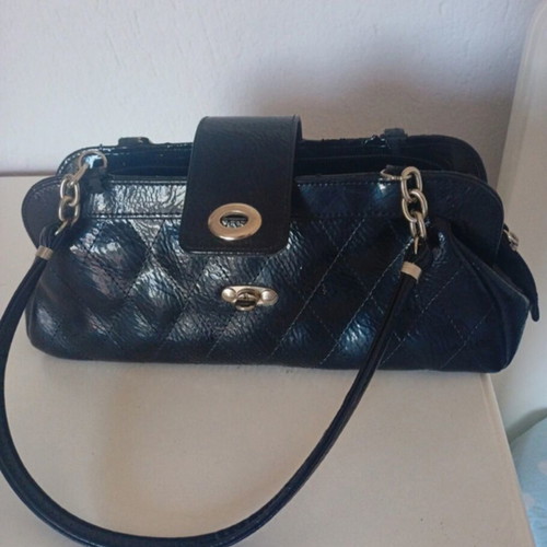 Women's black handbag with silver details, like new