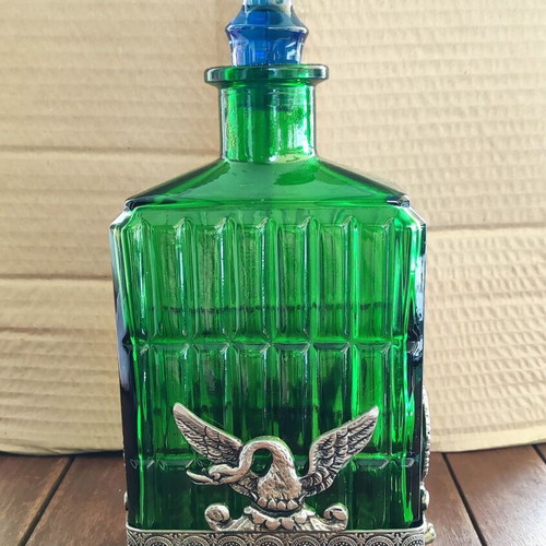 Vintage Italian glass bottle in metal base like new