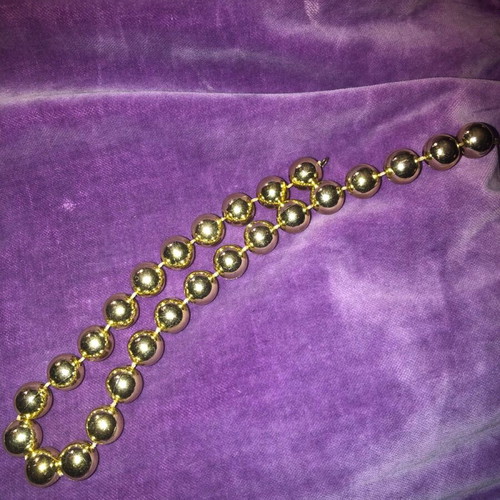 Necklace with gold-colored beads used, clasp needs replacement