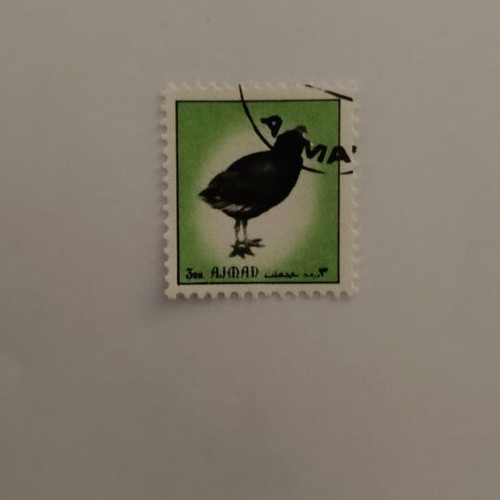 Stamp from United Arab Emirates with bird design, like new