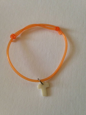 Orange bracelet with white cross used