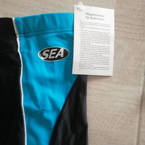 Children's swim trunks new, black and blue