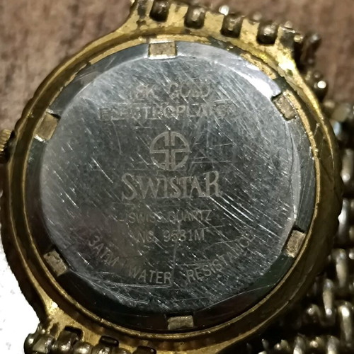 Swistar watch 18k gold plated used with visible signs of wear