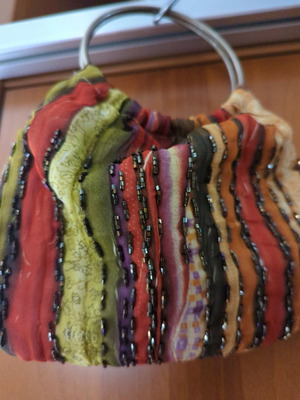 Evening fabric bag new with embroidery and metal handles multicolored