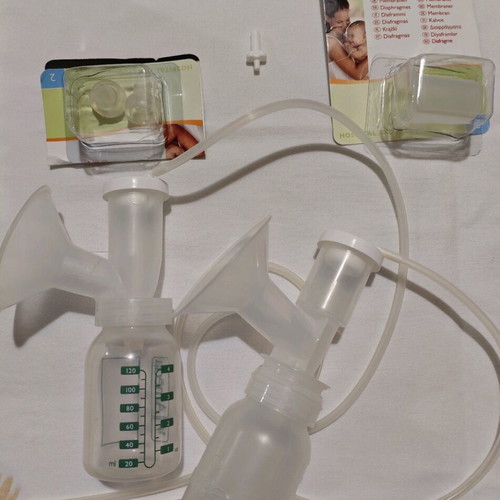 Ameda Purely Yours Una breast pump like new with 2 collection bottles and spare silicone