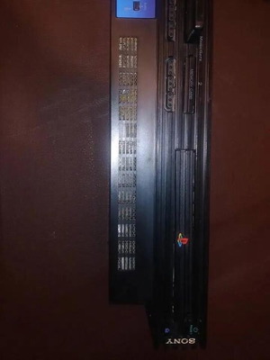 PlayStation 2 fat console with two games