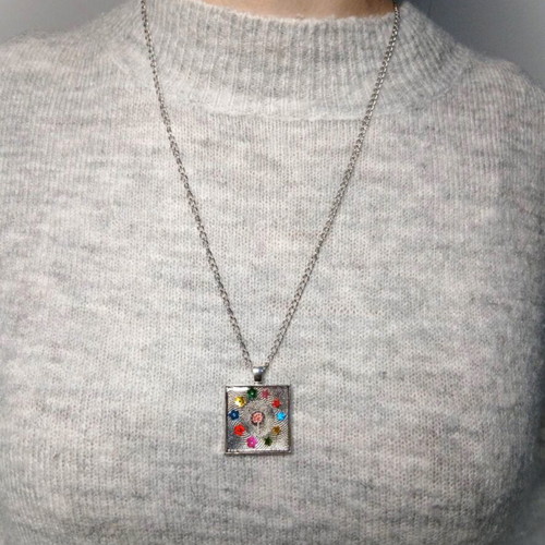 Handmade jewelry set with resin pendant and pink stone earrings