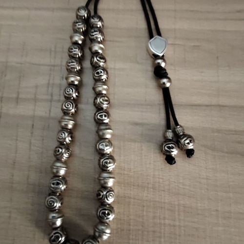 Handmade worry beads with metal beads and silver shield