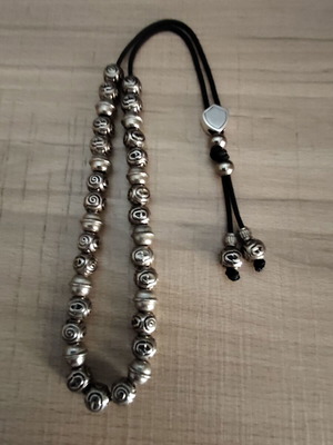 Handmade worry beads with metal beads and silver shield
