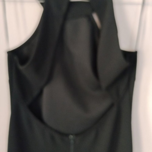 Black mini dress like new with open back and lace slit