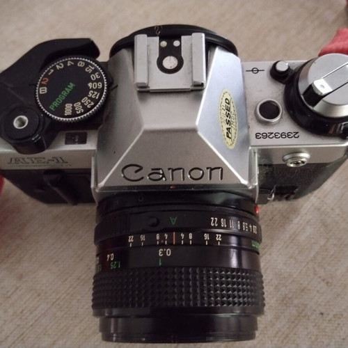 Canon AE-1 Program film camera with Canon FD28 lens and Tamron telephoto set like new