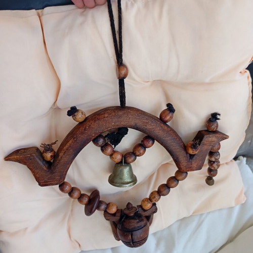 Asian decorative wooden item with brass bell used