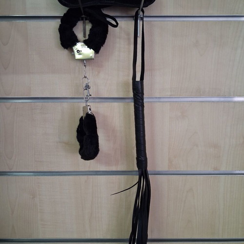 Adult black play set with mask, furry accessories, and whip