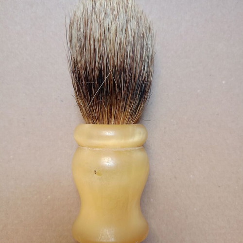 Two shaving brushes, one says it is made in West Germany.