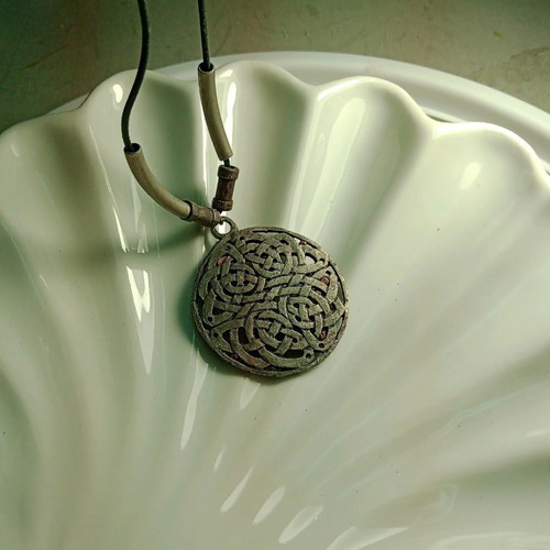 Pendant Celtic design like new with black adjustable leather strap