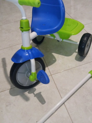 Children's tricycle bike with handle like new, blue and green