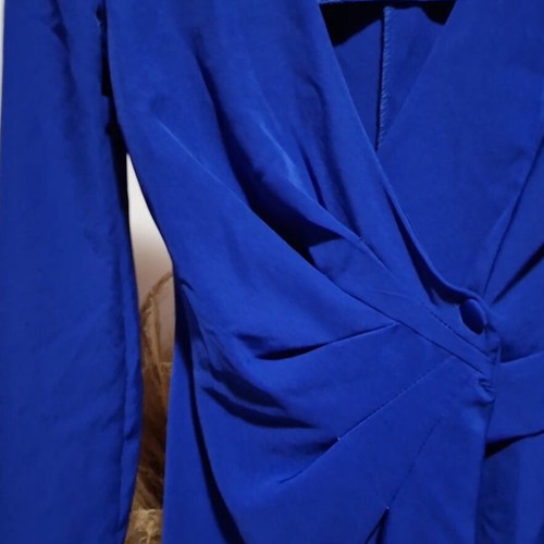 Blue dress like new with shoulder pads and decorative pocket