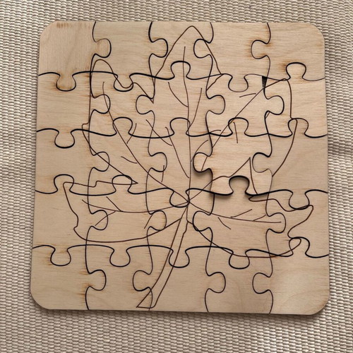 Wooden puzzle with autumn leaves like new